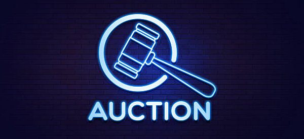 istockphoto-2224176762-612x612 A blue neon sign featuring an auction gavel icon and the word "AUCTION," set against a dark brick wall. This visual immediately communicates concepts of bidding, sales, and legal proceedings. The modern neon aesthetic makes it suitable for online auction websites, advertisements for auction houses, and articles related to finance, law, or real estate. The glowing sign creates a sense of importance and formal action, perfect for representing official decisions and high-stakes transactions.